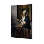 Woman Holding a Balance by Johannes Vermeer