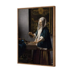 Woman Holding a Balance by Johannes Vermeer