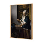 Woman Holding a Balance by Johannes Vermeer