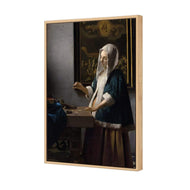 Woman Holding a Balance by Johannes Vermeer