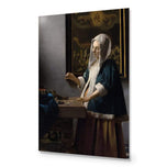 Woman Holding a Balance by Johannes Vermeer