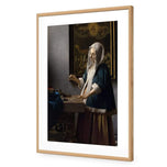 Woman Holding a Balance by Johannes Vermeer