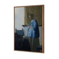 Woman in Blue Reading a Letter by Johannes Vermeer