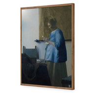 Woman in Blue Reading a Letter by Johannes Vermeer