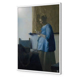 Woman in Blue Reading a Letter by Johannes Vermeer