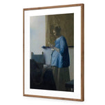 Woman in Blue Reading a Letter by Johannes Vermeer