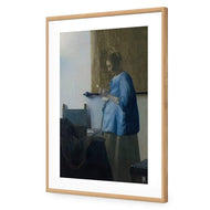 Woman in Blue Reading a Letter by Johannes Vermeer