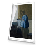 Woman in Blue Reading a Letter by Johannes Vermeer